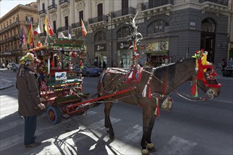 Colourfully decorated Sicilian horse-drawn cart on the Via Roma