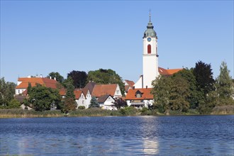 Zellersee lake and the Parish Church of St. Gallus and Ulrich