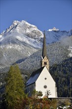 Reformed Church of St. George in front of mountains