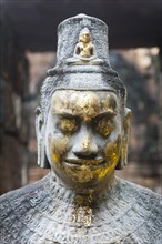 Buddhist statue of Bodhisattva Avalokiteshvara with offerings in the temple
