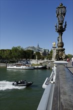 Pont Alexandre III bridge with the Seine and ship traffic