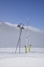 Cross-country skis and ski poles stuck in the snow