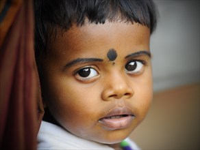 Child at a Hindu temple festival