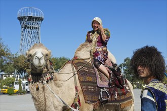 Local tourist on a camel outside the Ark fortress