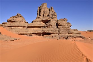 Rock towers in the sand dunes of Tin Merzouga