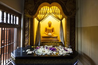 Buddha statue in the Temple of the Sacred Tooth Relic