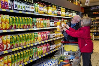Senior couple shopping in a supermarket