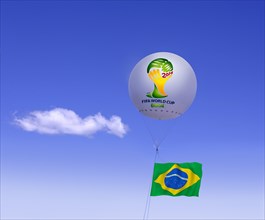 Logo of FIFA World Cup Brazil on moored balloon and Brazilian flag