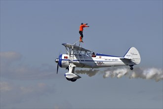 Wing walker on airplane
