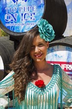 Young woman wearing a gypsy dress at the Feria del Caballo