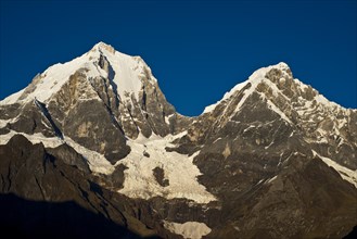 Snow capped mountains in morning light