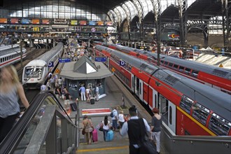 Station concourse with travelers