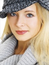 Young woman wearing a gray hat