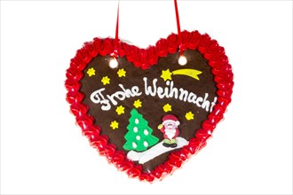 Gingerbread heart with the writing 'Frohe Weihnachten'