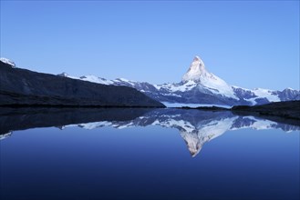 Mt Matterhorn reflected in Stellisee Lake at dusk