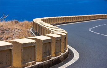 Road barrier on a curvy mountain road at El Suclum