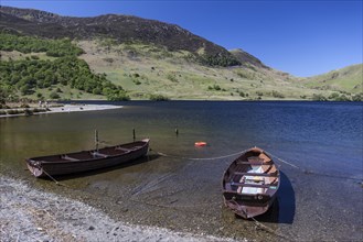 Boats on the shore of the lake of Crummock Water
