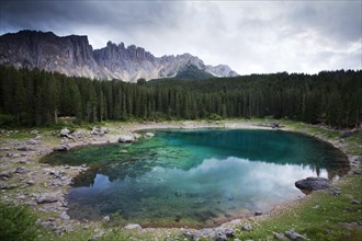 Lake Carezza with Latemar Mountain with clouds
