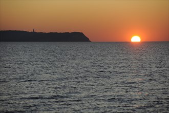 Sunset over the Baltic Sea beside Hiddensee Island with Dornbusch lighthouse