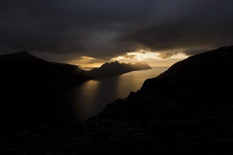 Dramatic mood lighting over the islands of Kalsoy and Kunoy