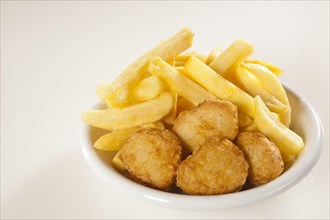 Chicken nuggets with chips or French fries