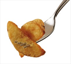 Potato wedges on a fork