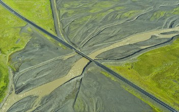 Aerial view of Ring Road No. 1 with a bridge crossing a tributary of the Skaftafellsa glacial river