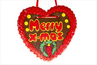 Gingerbread heart with the writing 'Merry X-mas'