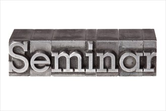 Old lead letters forming the word 'Seminar'