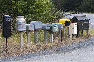 Row of different mailboxes on the roadside