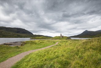 Footpath to the ruins of Ardvreck Castle on a peninsula in the lake of Loch Assynt