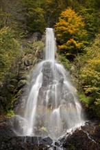 Waterfall in an autumnal landscape in Trusetal