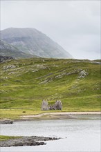 Lake of Loch Assynt with ruins on the shore