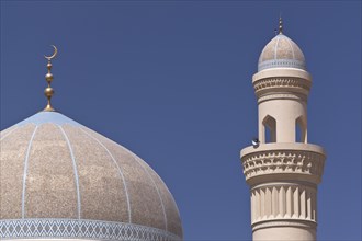 Mosque with a golden crescent moon and a minaret