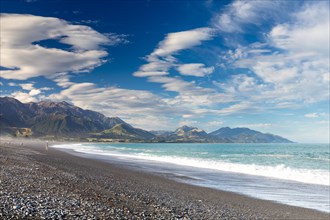 Dark beach of Kaikoura in front of the Kaikoura Range