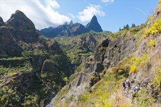 Group of hikers hiking in the rugged mountain landscape