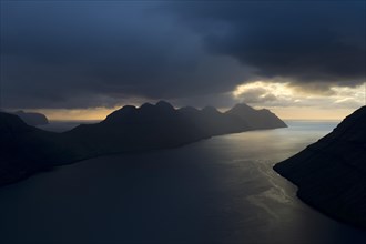 Dramatic mood lighting over the islands of Kalsoy and Kunoy