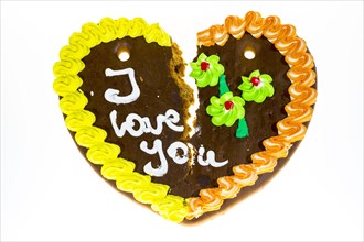 Broken gingerbread heart with the message 'I love you'