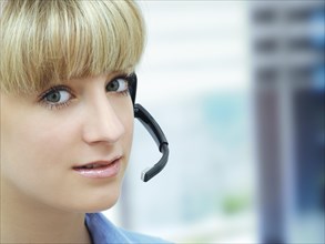 Businesswoman wearing a headset in an office