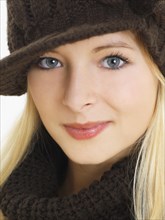 Young woman wearing a brown hat