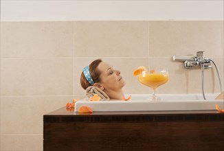 Woman relaxing in a bath
