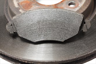 Worn brake disc with grooves from the brake pad