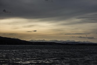 Foehn mood over Lake Pilsen with mountain views in winter