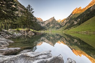 Mountains reflected at sunrise in Lake Seealpsee