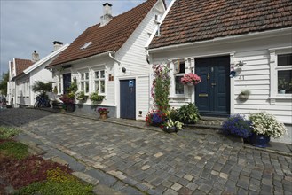 White wooden houses with floral decorations