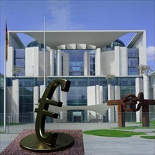 Sculpture of a euro sign in front of the German Federal Chancellery building