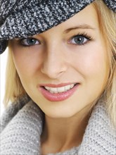 Young woman wearing a gray hat