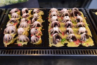 Baby octopus on grill at a food stall