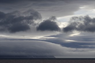 Storm clouds obscuring the mountain scenery in Palanderbukta fjord