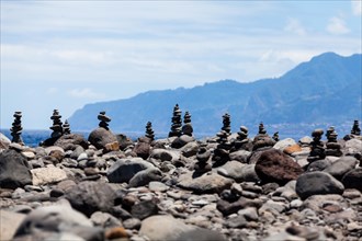 Cairns built as good luck charms at the Ilheus da Rib rock formation